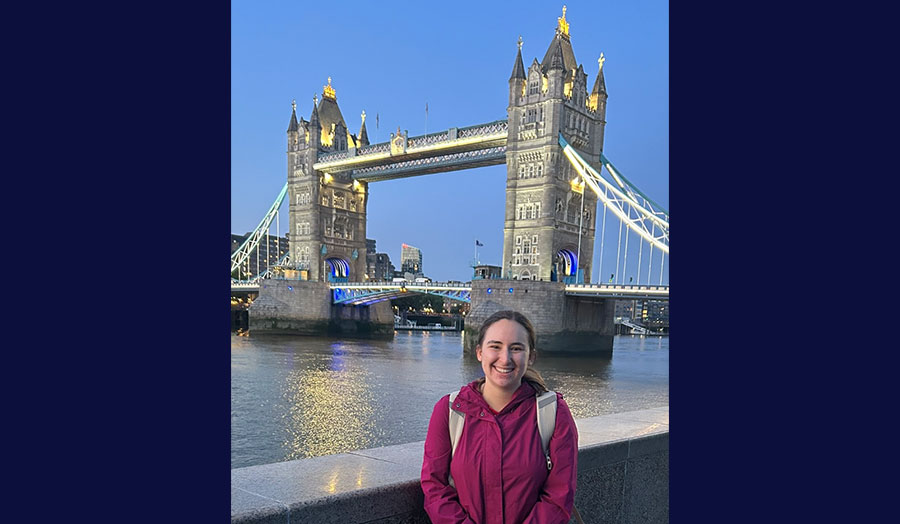 Madison pictured smiling in front of Tower Bridge London