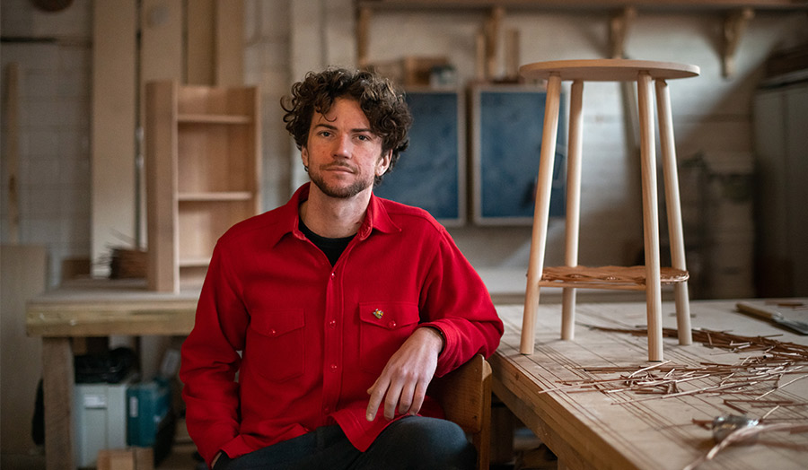 Moe Redish in his workshop with his willow and ash table