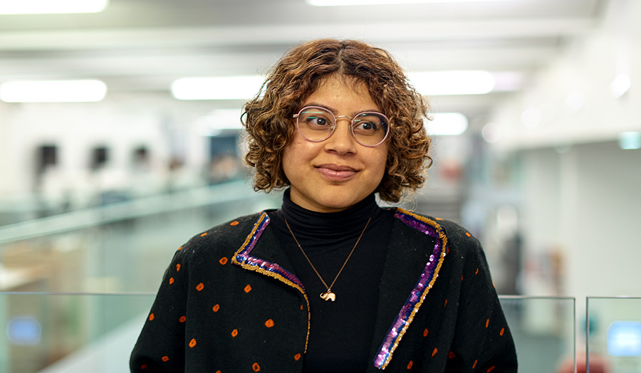 Neha pictured smiling in the Learning Resources Centre at Holloway Road