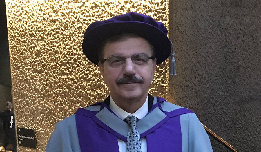 Nidhal Al-Sarraf pictured at his graduation in his robes at the Barbican