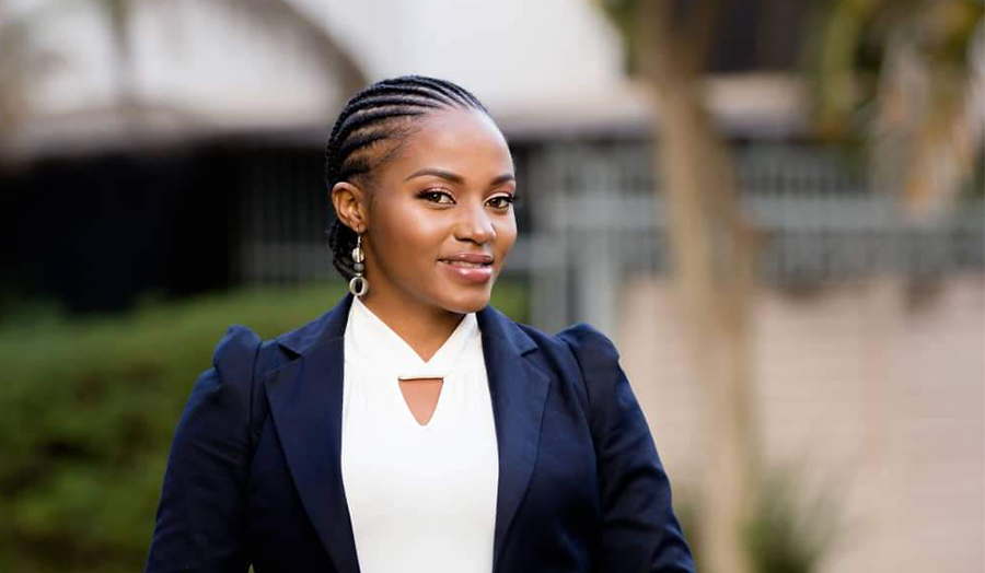 Victoria smiling wearing a smart blazer