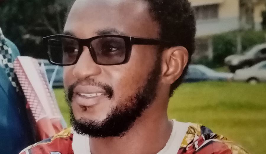 Wally Shannon Mbassi Elong, PhD student head shot wearing sunglasses and smiling