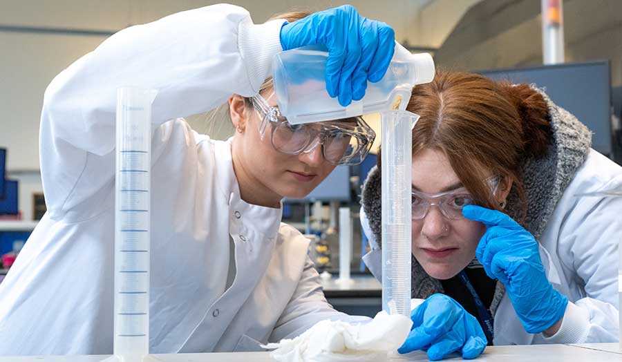 students measuring substances in the lab