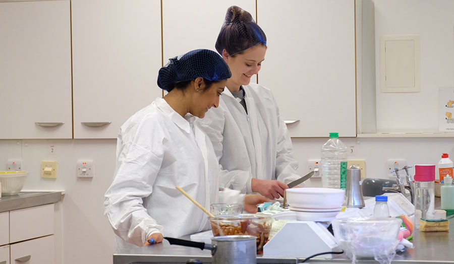 Two students work together during a dietetics practical lesson